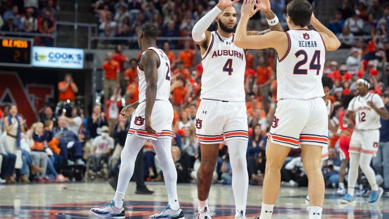 Auburn Tigers forward Johni Broome (4) and Auburn Tigers guard Lior Berman (24) celebrate Berman   s three-pointer as Auburn Tigers takes on Ole Miss Rebels at Neville Arena in Auburn, Ala., on Saturday, Jan. 20, 2024. Auburn Tigers lead Ole Miss Rebels 46-27 at halftime.