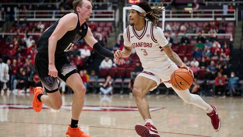 Jan 20, 2024; Stanford, California, USA; Stanford Cardinal guard Kanaan Carlyle (3) dribbles the ball against Washington Huskies forward Moses Wood (13) during the first half at Maples Pavilion. Mandatory Credit: Robert Edwards-USA TODAY Sports