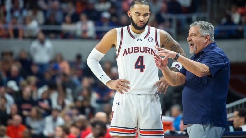Auburn Tigers head coach Bruce Pearl talks with forward Johni Broome (4) as Auburn Tigers takes on Ole Miss Rebels at Neville Arena in Auburn, Ala., on Saturday, Jan. 20, 2024. Auburn Tigers defeated Ole Miss Rebels 82-59.