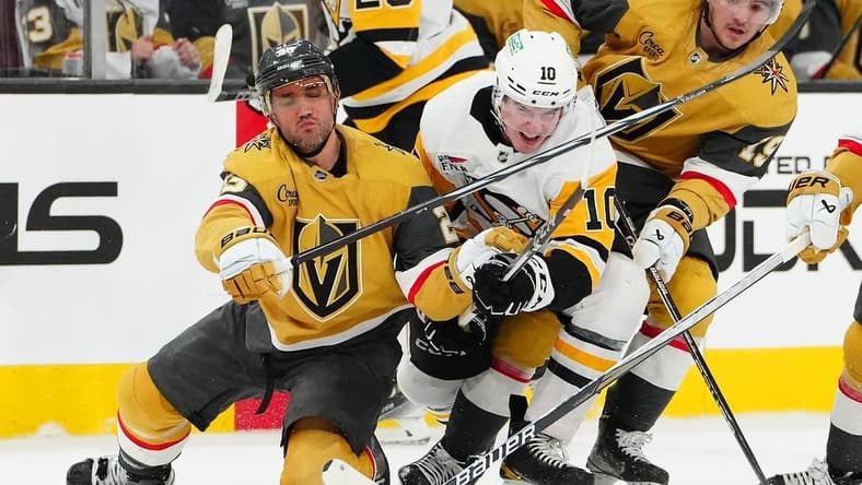 Jan 20, 2024; Las Vegas, Nevada, USA; Vegas Golden Knights defenseman Alec Martinez (23) keeps Pittsburgh Penguins left wing Drew O'Connor (10) from the puck during the second period at T-Mobile Arena. Mandatory Credit: Stephen R. Sylvanie-USA TODAY Sports