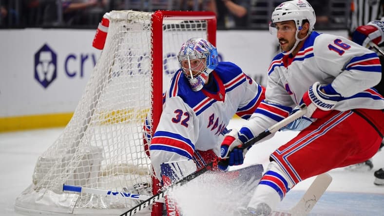 Jan 20, 2024; Los Angeles, California, USA; New York Rangers center Vincent Trocheck (16) helps goaltender Jonathan Quick (32) defend the goal against the Los Angeles Kings durng the second period at Crypto.com Arena. Mandatory Credit: Gary A. Vasquez-USA TODAY Sports
