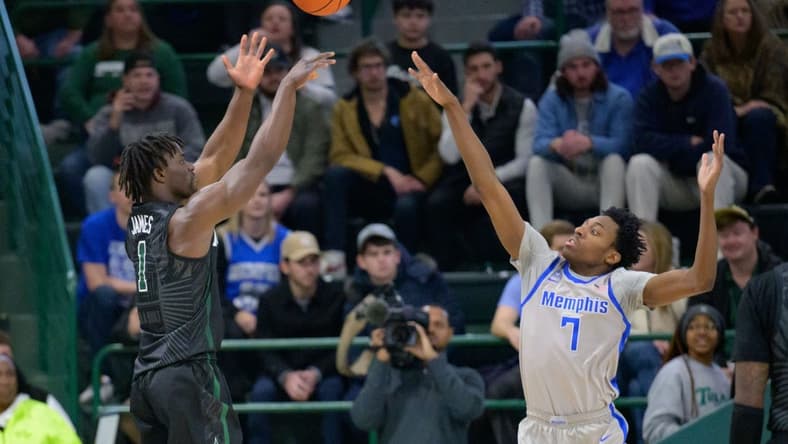 Jan 21, 2024; New Orleans, Louisiana, USA; Tulane Green Wave guard Sion James (1) shoots over Memphis Tigers forward Nae'Qwan Tomlin (7) during the first half at Avron B. Fogelman Arena in Devlin Fieldhouse. Mandatory Credit: Matthew Hinton-USA TODAY Sports