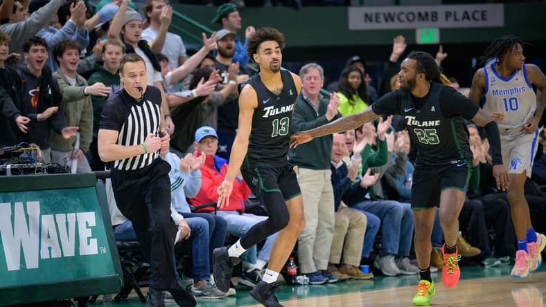 Jan 21, 2024; New Orleans, Louisiana, USA; Tulane Green Wave guard Tre' Williams (13) celebrates a three point basket against the Memphis Tigers during the first half at Avron B. Fogelman Arena in Devlin Fieldhouse. Mandatory Credit: Matthew Hinton-USA TODAY Sports