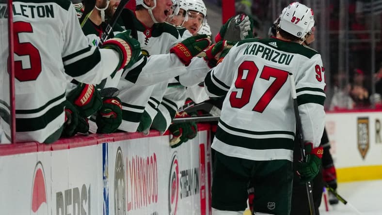 Jan 21, 2024; Raleigh, North Carolina, USA; Minnesota Wild left wing Kirill Kaprizov (97) celebrates his empty net goal against the Carolina Hurricanes during the third periodat PNC Arena. Mandatory Credit: James Guillory-USA TODAY Sports