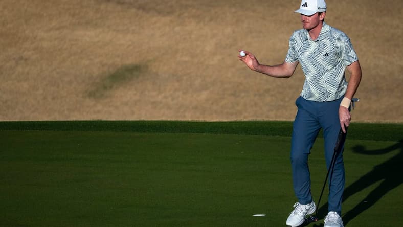 Nick Dunlap gestures to the gallery after putting for a birdie on the 16th green on the Pete Dye Stadium Course during the final round of The American Express at PGA West in La Quinta, Calif., Sunday, Jan. 21, 2024.