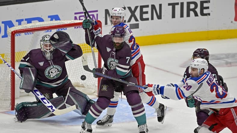 Jan 21, 2024; Anaheim, California, USA; Anaheim Ducks goaltender Lukas Dostal (1) looks to make a glove save off a shot by New York Rangers left wing Chris Kreider (20) as Anaheim Ducks defenseman Radko Gudas (7) and New York Rangers right wing Kaapo Kakko (24) battle in front of the net in the first period at Honda Center. Mandatory Credit: Jayne Kamin-Oncea-USA TODAY Sports