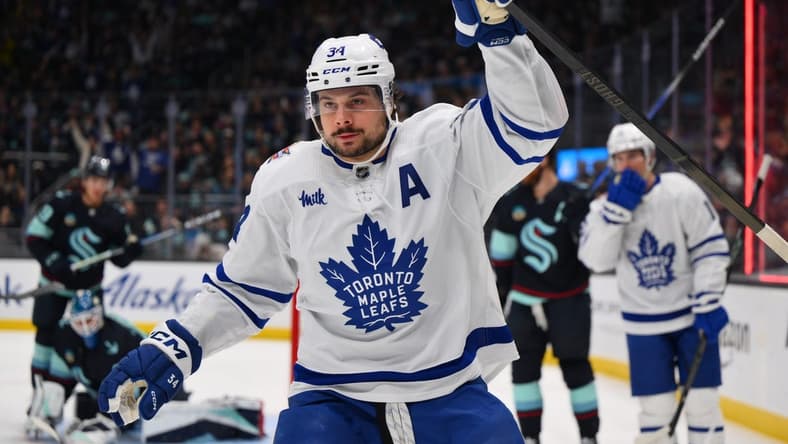 Jan 21, 2024; Seattle, Washington, USA; Toronto Maple Leafs center Auston Matthews (34) celebrates after scoring a goal against the Seattle Kraken during the first period at Climate Pledge Arena. Mandatory Credit: Steven Bisig-USA TODAY Sports