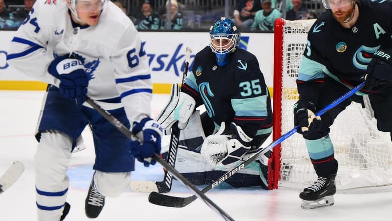 Jan 21, 2024; Seattle, Washington, USA; Seattle Kraken goaltender Joey Daccord (35) defends the goal during the third period against the Toronto Maple Leafs at Climate Pledge Arena. Mandatory Credit: Steven Bisig-USA TODAY Sports