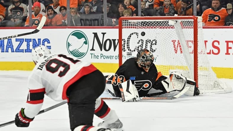 Jan 21, 2024; Philadelphia, Pennsylvania, USA; Ottawa Senators right wing Vladimir Tarasenko (91) scores a goal against Philadelphia Flyers goaltender Samuel Ersson (33) during the third period at Wells Fargo Center. Mandatory Credit: Eric Hartline-USA TODAY Sports