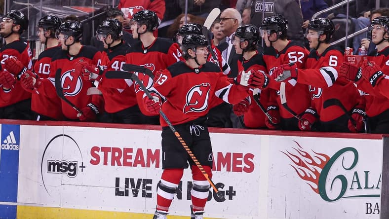 Jan 22, 2024; Newark, New Jersey, USA; New Jersey Devils center Nico Hischier (13) celebrates his goal with teammates during the second period against the Vegas Golden Knights at Prudential Center. Mandatory Credit: Vincent Carchietta-USA TODAY Sports