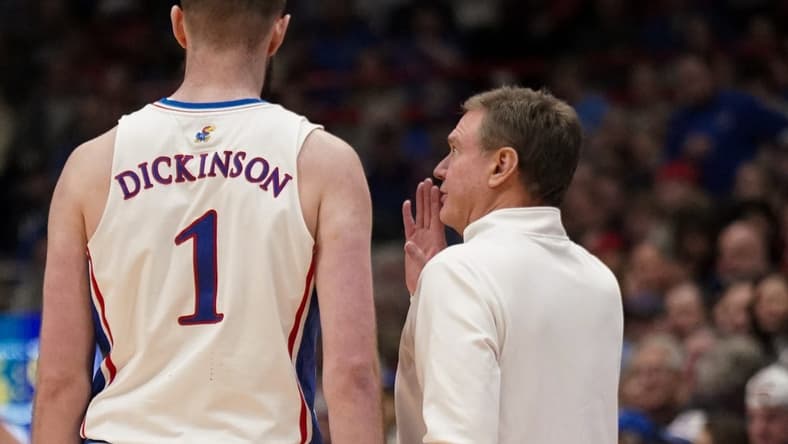 Jan 22, 2024; Lawrence, Kansas, USA; Kansas Jayhawks center Hunter Dickinson (1) talks with head coach Bill Self against the Cincinnati Bearcats during the first half at Allen Fieldhouse. Mandatory Credit: Denny Medley-USA TODAY Sports