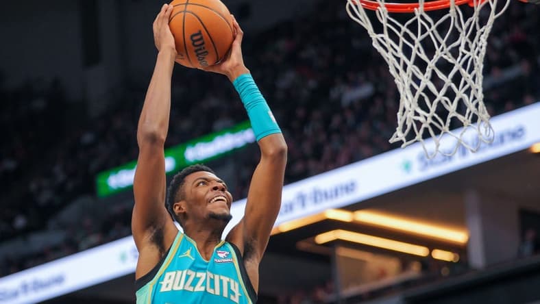 Jan 22, 2024; Minneapolis, Minnesota, USA; Charlotte Hornets forward Brandon Miller (24) dunks against the Minnesota Timberwolves in the third quarter at Target Center. Mandatory Credit: Brad Rempel-USA TODAY Sports