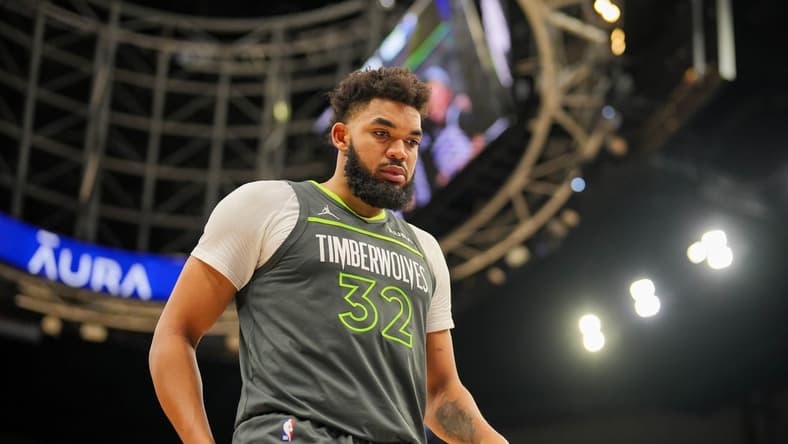 Jan 22, 2024; Minneapolis, Minnesota, USA; Minnesota Timberwolves center Karl-Anthony Towns (32) sets a franchise record with 62 points against the Charlotte Hornets at Target Center. Mandatory Credit: Brad Rempel-USA TODAY Sports
