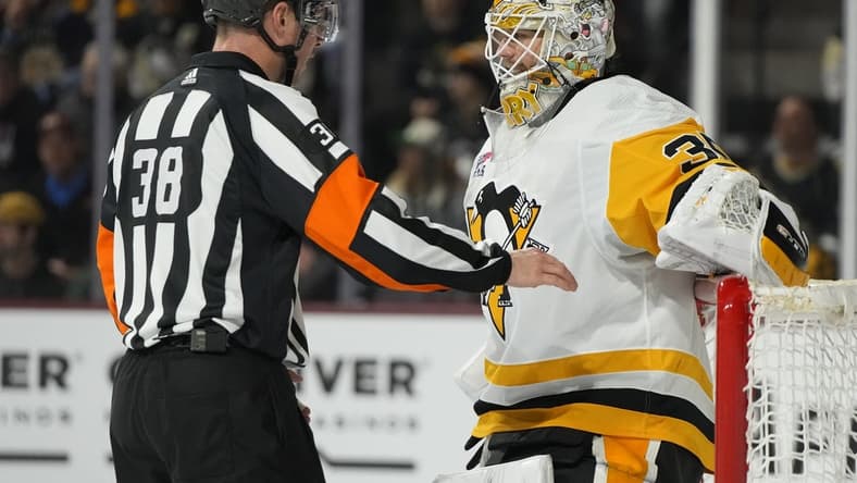 Jan 22, 2024; Tempe, Arizona, USA; Pittsburgh Penguins goaltender Tristan Jarry (35) talks to NHL referee Peter McDougall during a timeout in the second period against the Arizona Coyotes at Mullett Arena. Mandatory Credit: Rick Scuteri-USA TODAY Sports