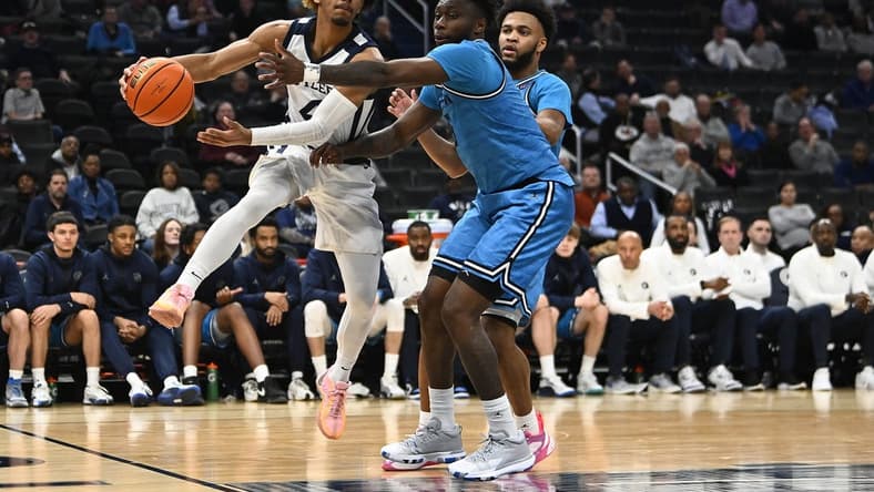 Jan 23, 2024; Washington, District of Columbia, USA; Butler Bulldogs guard DJ Davis (4) passes around Georgetown Hoyas guard Jay Heath (5) during the first half at Capital One Arena. Mandatory Credit: Brad Mills-USA TODAY Sports