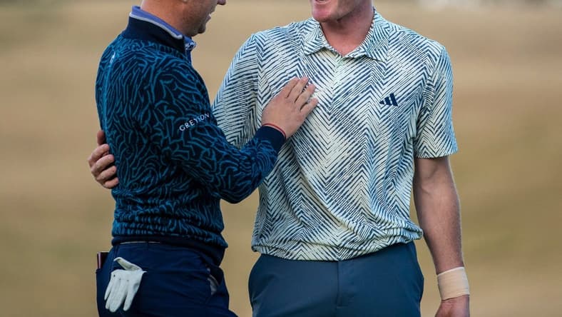 Nick Dunlap (right) embraces Justin Thomas after winning the final round of The American Express at PGA West in La Quinta, Calif., Sunday, Jan. 21, 2024.