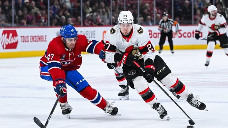 Jan 23, 2024; Montreal, Quebec, CAN; Ottawa Senators left wing Parker Kelly (27) plays the puck against Montreal Canadiens defenseman Jayden Struble (47) during the first period at Bell Centre. Mandatory Credit: David Kirouac-USA TODAY Sports