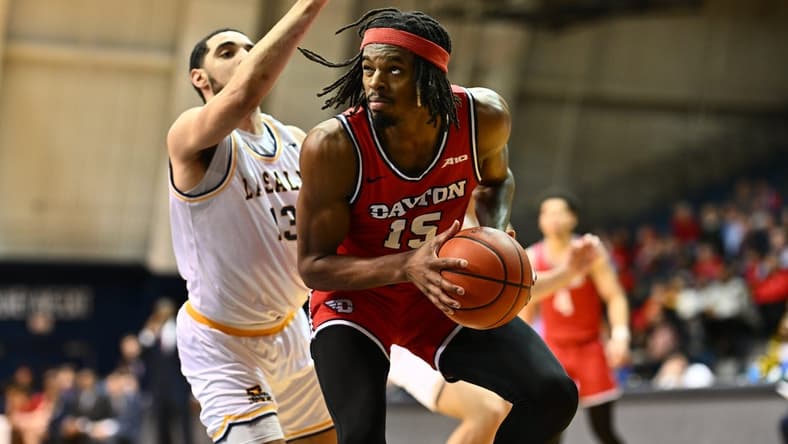 Jan 23, 2024; Philadelphia, Pennsylvania, USA; Dayton Flyers forward DaRon Holmes II (15) controls the ball against La Salle Explorers guard Daeshon Shepherd (13) in the first half at Tom Gola Arena at TruMark Financial Center. Mandatory Credit: Kyle Ross-USA TODAY Sports