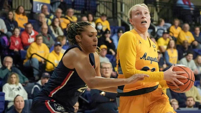 UConn Huskies forward Ice Brady (25) guards Marquette Golden Eagles forward Liza Karlen (32) during the first half of their game Tuesday, Jan. 23, 2024, at the Al McGuire Center in Milwaukee. Ebony Cox / Milwaukee Journal Sentinel