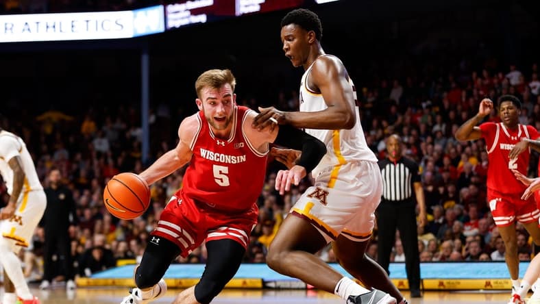 Jan 23, 2024; Minneapolis, Minnesota, USA; Wisconsin Badgers forward Tyler Wahl (5) works around Minnesota Golden Gophers forward Pharrel Payne (21) during the second half at Williams Arena. Mandatory Credit: Matt Krohn-USA TODAY Sports