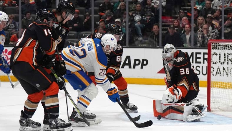 Jan 23, 2024; Anaheim, California, USA; Buffalo Sabres right wing Jack Quinn (22) shoots the puck against Anaheim Ducks goaltender John Gibson (36 at Honda Center. Mandatory Credit: Kirby Lee-USA TODAY Sports