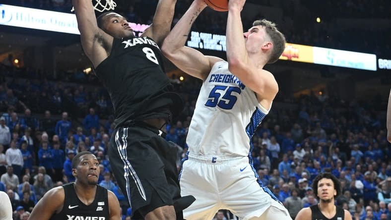 Jan 23, 2024; Omaha, Nebraska, USA; Creighton Bluejays guard Baylor Scheierman (55) attempts a shot against Xavier Musketeers guard Quincy Olivari (8) in the second half at CHI Health Center Omaha. Mandatory Credit: Steven Branscombe-USA TODAY Sports