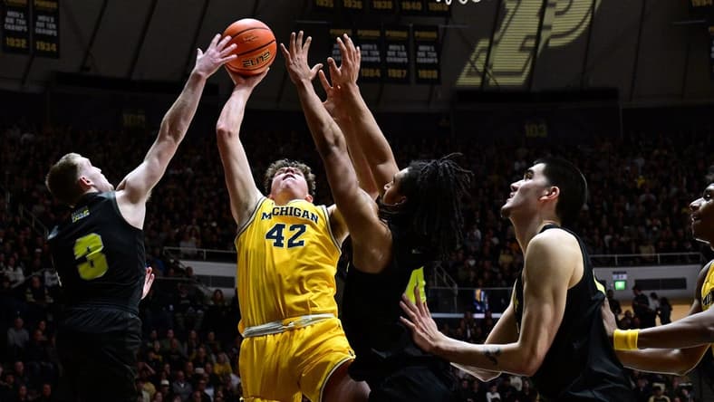 Jan 23, 2024; West Lafayette, Indiana, USA; Michigan Wolverines forward Will Tschetter (42) has a shot blocked by Purdue Boilermakers guard Braden Smith (3) during the first half at Mackey Arena. Mandatory Credit: Marc Lebryk-USA TODAY Sports