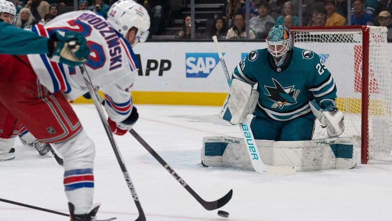 Jan 23, 2024; San Jose, California, USA; New York Rangers center Jonny Brodzinski (22) shoots the puck during the first period against San Jose Sharks goaltender Mackenzie Blackwood (29) at SAP Center at San Jose. Mandatory Credit: Stan Szeto-USA TODAY Sports