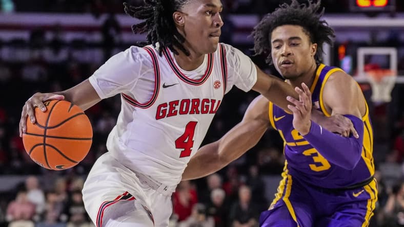 Jan 24, 2024; Athens, Georgia, USA; Georgia Bulldogs guard Silas Demary Jr. (4) dribbles against LSU Tigers guard Jalen Cook (3) during the first half at Stegeman Coliseum. Mandatory Credit: Dale Zanine-USA TODAY Sports