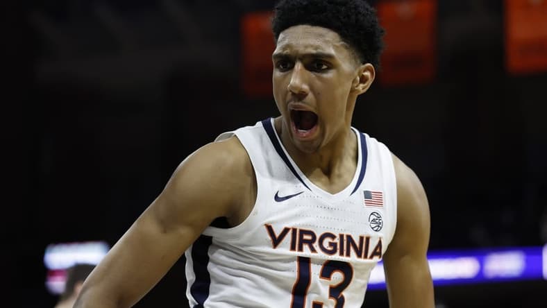 Jan 24, 2024; Charlottesville, Virginia, USA; Virginia Cavaliers guard Ryan Dunn (13) reacts after a dunk against the North Carolina State Wolfpack in overtime at John Paul Jones Arena. Mandatory Credit: Geoff Burke-USA TODAY Sports