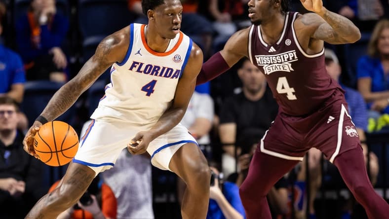 Jan 24, 2024; Gainesville, Florida, USA; Mississippi State Bulldogs forward Cameron Matthews (4) defends Florida Gators forward Tyrese Samuel (4) during the first half at Exactech Arena at the Stephen C. O'Connell Center. Mandatory Credit: Matt Pendleton-USA TODAY Sports