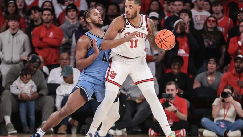 Jan 24, 2024; New York, New York, USA;  St. John's Red Storm center Joel Soriano (11) looks to post up against Villanova Wildcats forward Eric Dixon (43) in the first half at Madison Square Garden. Mandatory Credit: Wendell Cruz-USA TODAY Sports