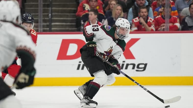 Jan 24, 2024; Sunrise, Florida, USA; Arizona Coyotes left wing Matias Maccelli (63) brings the puck up the ice during the first against the Florida Panthers at Amerant Bank Arena. Mandatory Credit: Jim Rassol-USA TODAY Sports