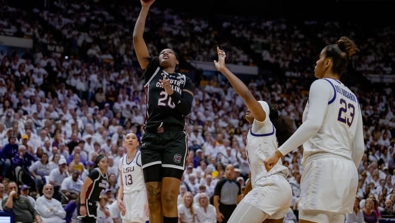 Jan 25, 2024; Baton Rouge, Louisiana, USA; South Carolina Gamecocks forward Sania Feagin (20) shoots against LSU Lady Tigers guard Aneesah Morrow during the second half at Pete Maravich Assembly Center. Mandatory Credit: Matthew Hinton-USA TODAY Sports