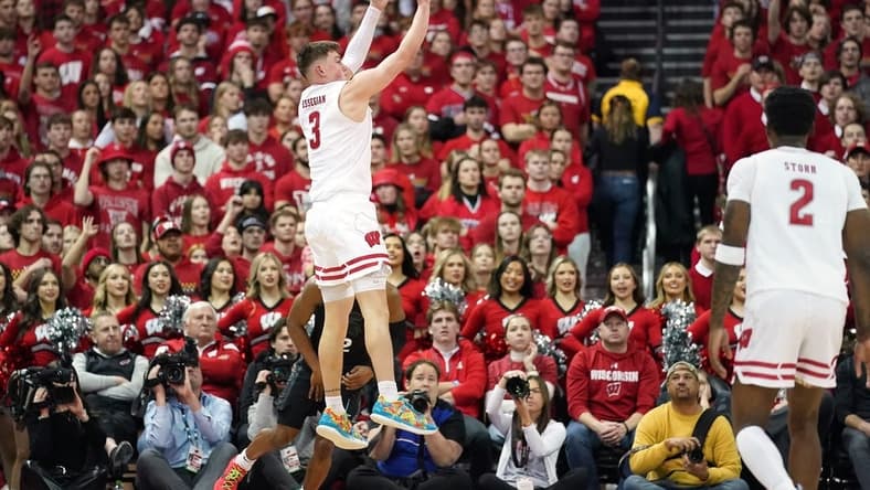 Jan 26, 2024; Madison, Wisconsin, USA; Wisconsin Badgers guard Connor Essegian (3) scores a three point basket against the Michigan State Spartans during the first half at the Kohl Center. Mandatory Credit: Kayla Wolf-USA TODAY Sports