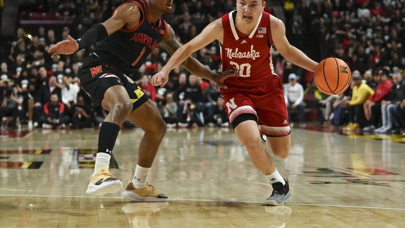 Jan 27, 2024; College Park, Maryland, USA;  Nebraska Cornhuskers guard Keisei Tominaga (30) drives to the basket on Maryland Terrapins guard Jahmir Young (1) during the first half at Xfinity Center. Mandatory Credit: Tommy Gilligan-USA TODAY Sports
