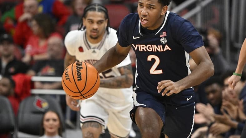 Jan 27, 2024; Louisville, Kentucky, USA;  Virginia Cavaliers guard Reece Beekman (2) dribbles against the Louisville Cardinals during the first half at KFC Yum! Center. Mandatory Credit: Jamie Rhodes-USA TODAY Sports