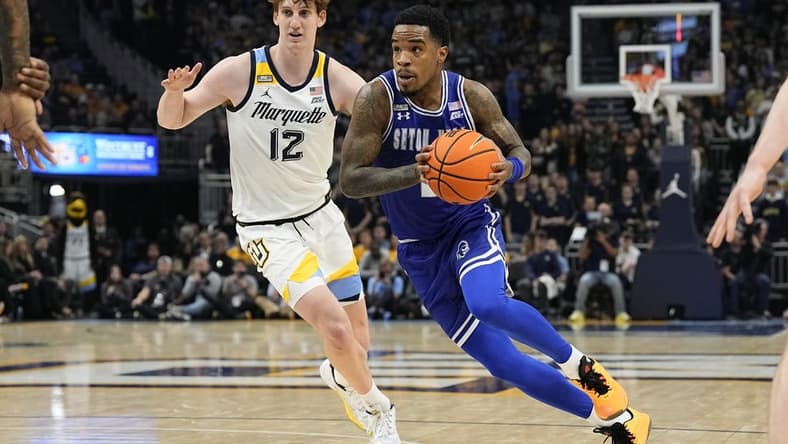 Jan 27, 2024; Milwaukee, Wisconsin, USA;  Seton Hall Pirates guard Al-Amir Dawes (2) drives for the basket in front of Marquette Golden Eagles forward Ben Gold (12) during the first half at Fiserv Forum. Mandatory Credit: Jeff Hanisch-USA TODAY Sports