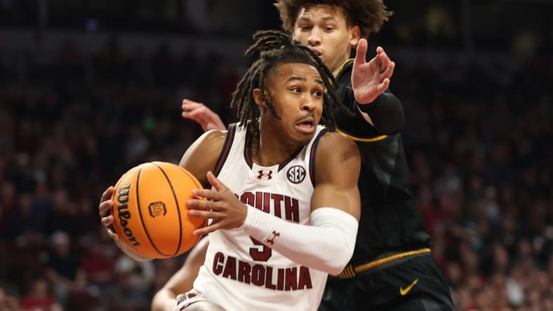 Jan 27, 2024; Columbia, South Carolina, USA; South Carolina Gamecocks guard Meechie Johnson (5) drives around Missouri Tigers forward Jordan Butler (0) in the first half at Colonial Life Arena. Mandatory Credit: Jeff Blake-USA TODAY Sports