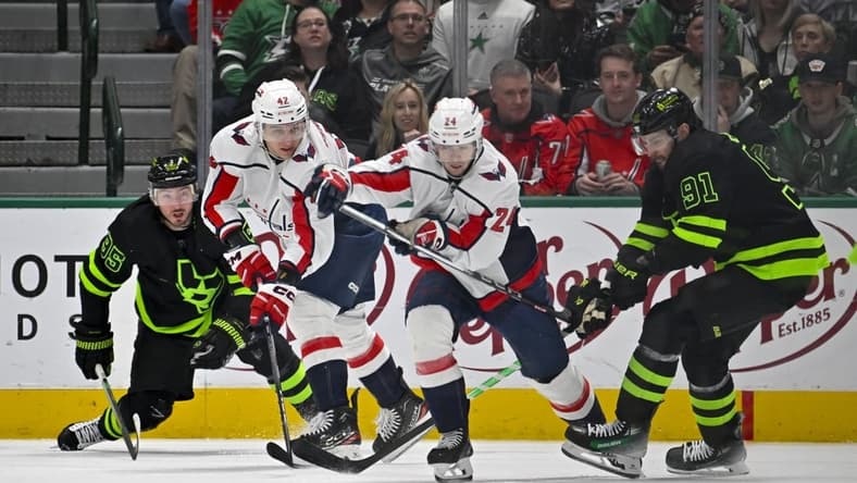 Jan 27, 2024; Dallas, Texas, USA; Dallas Stars center Matt Duchene (95) and center Tyler Seguin (91) and Washington Capitals defenseman Martin Fehervary (42) and center Connor McMichael (24) chase the puck during the first period at the American Airlines Center. Mandatory Credit: Jerome Miron-USA TODAY Sports