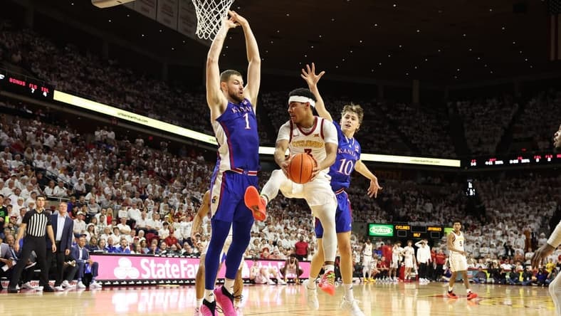 Feb 4, 2023; Ames, Iowa, USA; Iowa State Cyclones guard Tamin Lipsey (3) is trapped by Kansas Jayhawks center Hunter Dickinson (1) and guard Johnny Furphy (10) at James H. Hilton Coliseum. Mandatory Credit: Reese Strickland-USA TODAY Sports