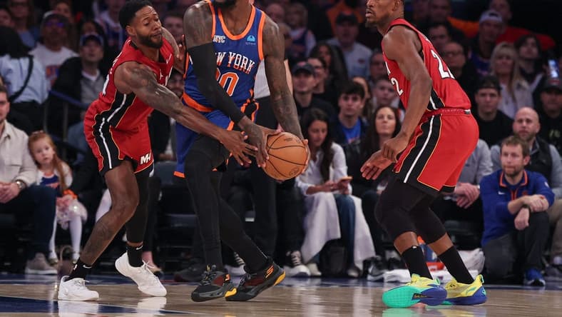 Jan 27, 2024; New York, New York, USA; New York Knicks forward Julius Randle (30) looks to pass as Miami Heat forward Haywood Highsmith (24) and forward Jimmy Butler (22) defend during the first half at Madison Square Garden. Mandatory Credit: Vincent Carchietta-USA TODAY Sports