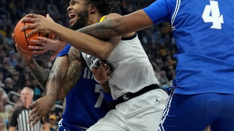 Marquette forward David Joplin (23) drives between Seton Hall forward Sadraque NgaNga (7) and center Elijah Hutchins-Everett (4) during the first half of their game Saturday, January 27, 2024 at Fiserv Forum in Milwaukee, Wisconsin.Mark Hoffman/Milwaukee Journal Sentinel