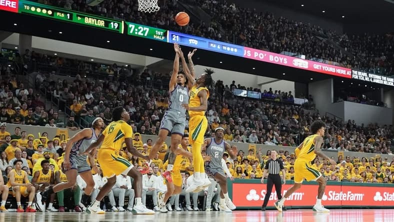 Jan 27, 2024; Waco, Texas, USA; TCU Horned Frogs guard Micah Peavy (0) shoots over Baylor Bears guard Ja'Kobe Walter (4) during the first half at Paul and Alejandra Foster Pavilion. Mandatory Credit: Raymond Carlin III-USA TODAY Sports