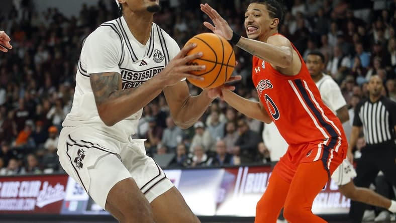 Jan 27, 2024; Starkville, Mississippi, USA; Mississippi State Bulldogs forward Tolu Smith (1) shoots as Auburn Tigers guard/forward Chad Baker-Mazara (10) defends during the second half at Humphrey Coliseum. Mandatory Credit: Petre Thomas-USA TODAY Sports