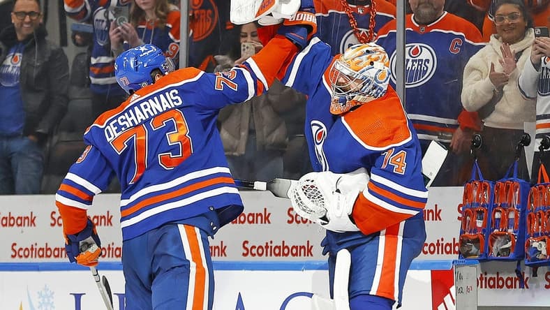 Jan 27, 2024; Edmonton, Alberta, CAN; Edmonton Oilers defensemen Vincent Desharnais (73) and goaltender Stuart Skinner (74) celebrate the Oilers 4-1 victory over the Nashville Predators. It is the Oilers 16th straight win at Rogers Place. Mandatory Credit: Perry Nelson-USA TODAY Sports