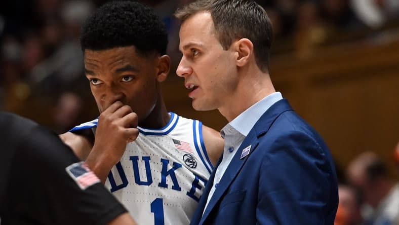 Jan 27, 2024; Durham, North Carolina, USA;Duke Blue Devils head coach Jon Scheyer (right) talks to guard Caleb Foster (1) during the second half against the Clemson Tigers at Cameron Indoor Stadium. Mandatory Credit: Rob Kinnan-USA TODAY Sports