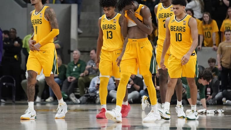 Jan 27, 2024; Waco, Texas, USA; Baylor Bears guard Ja'Kobe Walter (4) and teammates walk to the bench after a flagrant foul in TCU during the third overtime at Paul and Alejandra Foster Pavilion. Mandatory Credit: Raymond Carlin III-USA TODAY Sports
