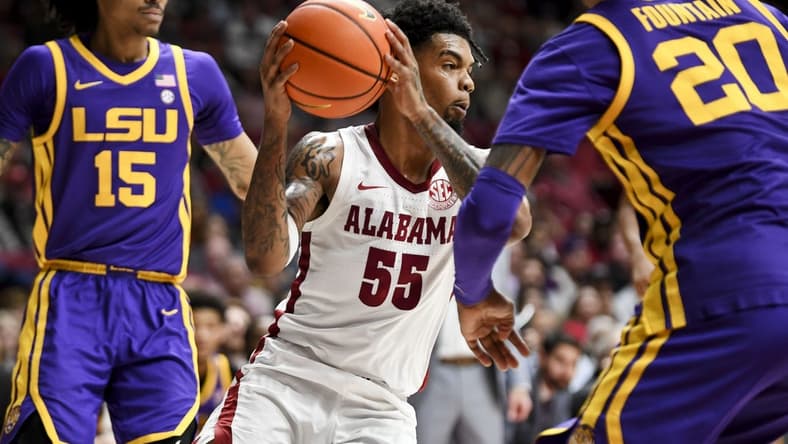 Jan 27, 2024; Tuscaloosa, Alabama, USA;  Alabama guard Aaron Estrada cuts between LSU forward Tyrell Ward (15) and LSU forward Derek Fountain (20) at Coleman Coliseum. Mandatory Credit: Gary Cosby Jr.-USA TODAY Sports
