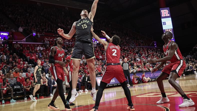 Jan 28, 2024; Piscataway, New Jersey, USA; Purdue Boilermakers center Zach Edey (15) lays the ball in for a basket during the first half in front of Rutgers Scarlet Knights center Clifford Omoruyi (11) and guard Noah Fernandes (2) at Jersey Mike's Arena. Mandatory Credit: Vincent Carchietta-USA TODAY Sports